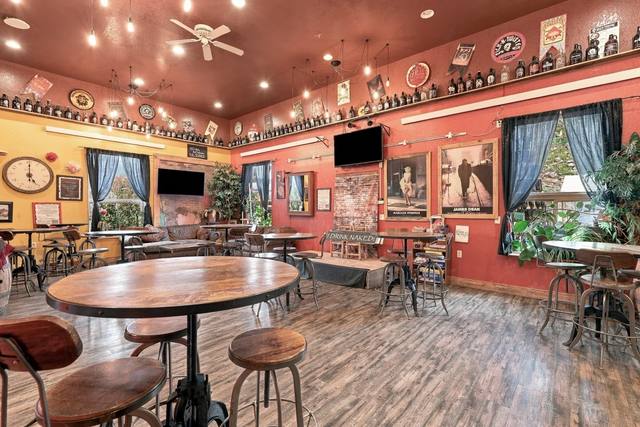 Taproom with high ceilings and tall windows