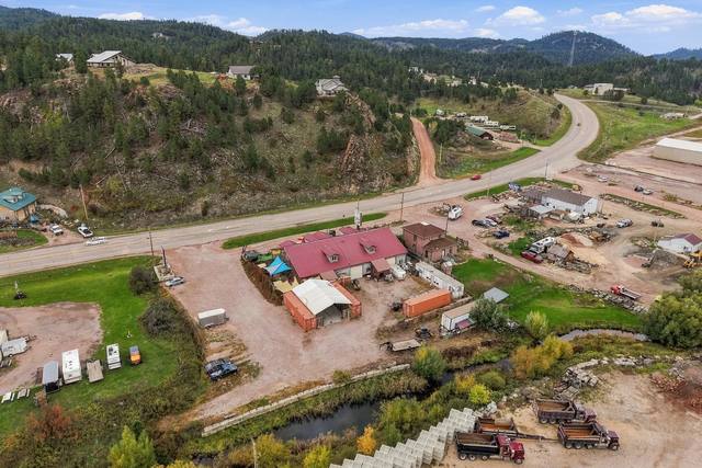 Aerial with Spring Creek behind the building